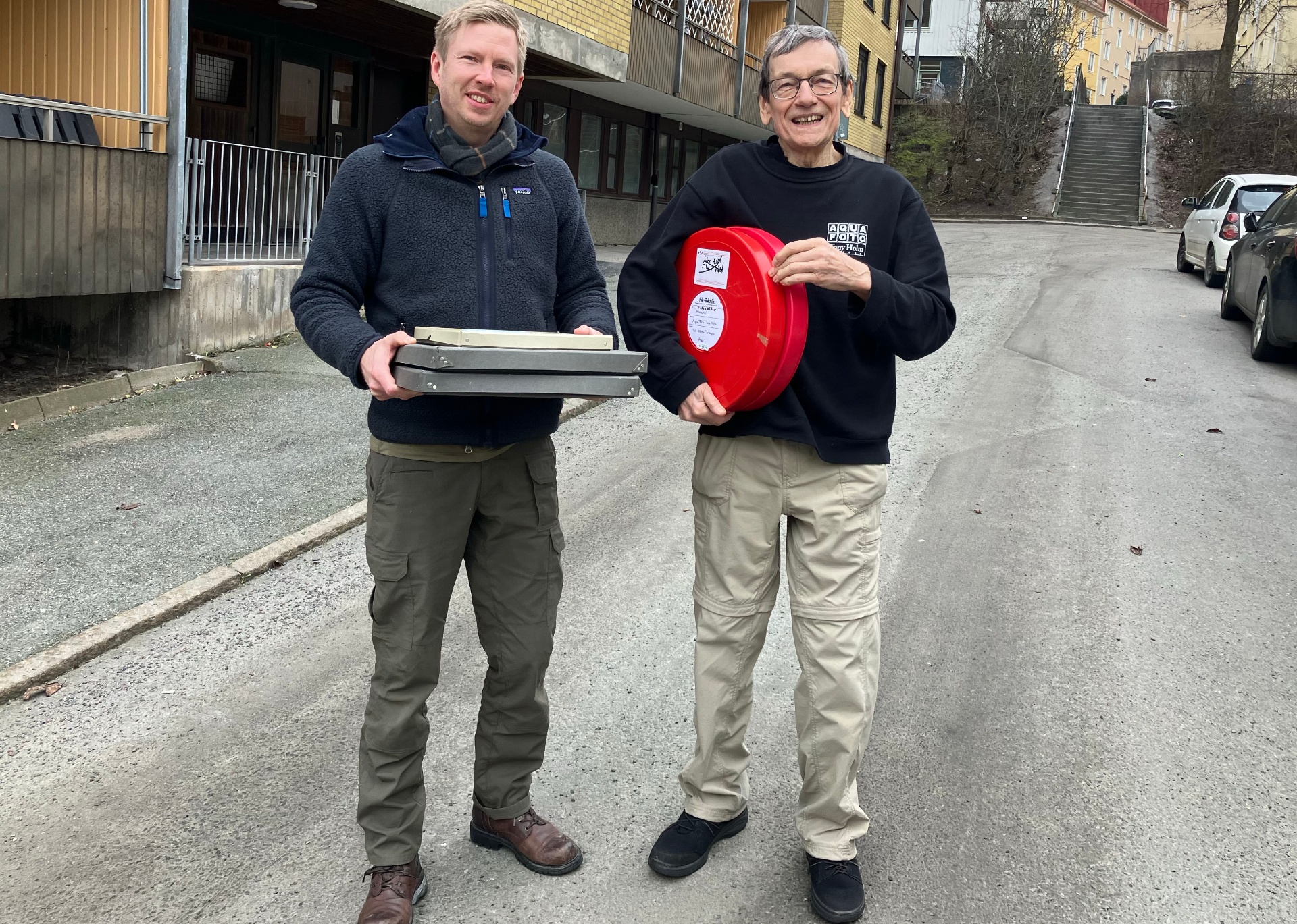 Tony Holm hands over film reels and archival material to Ocean Archive.