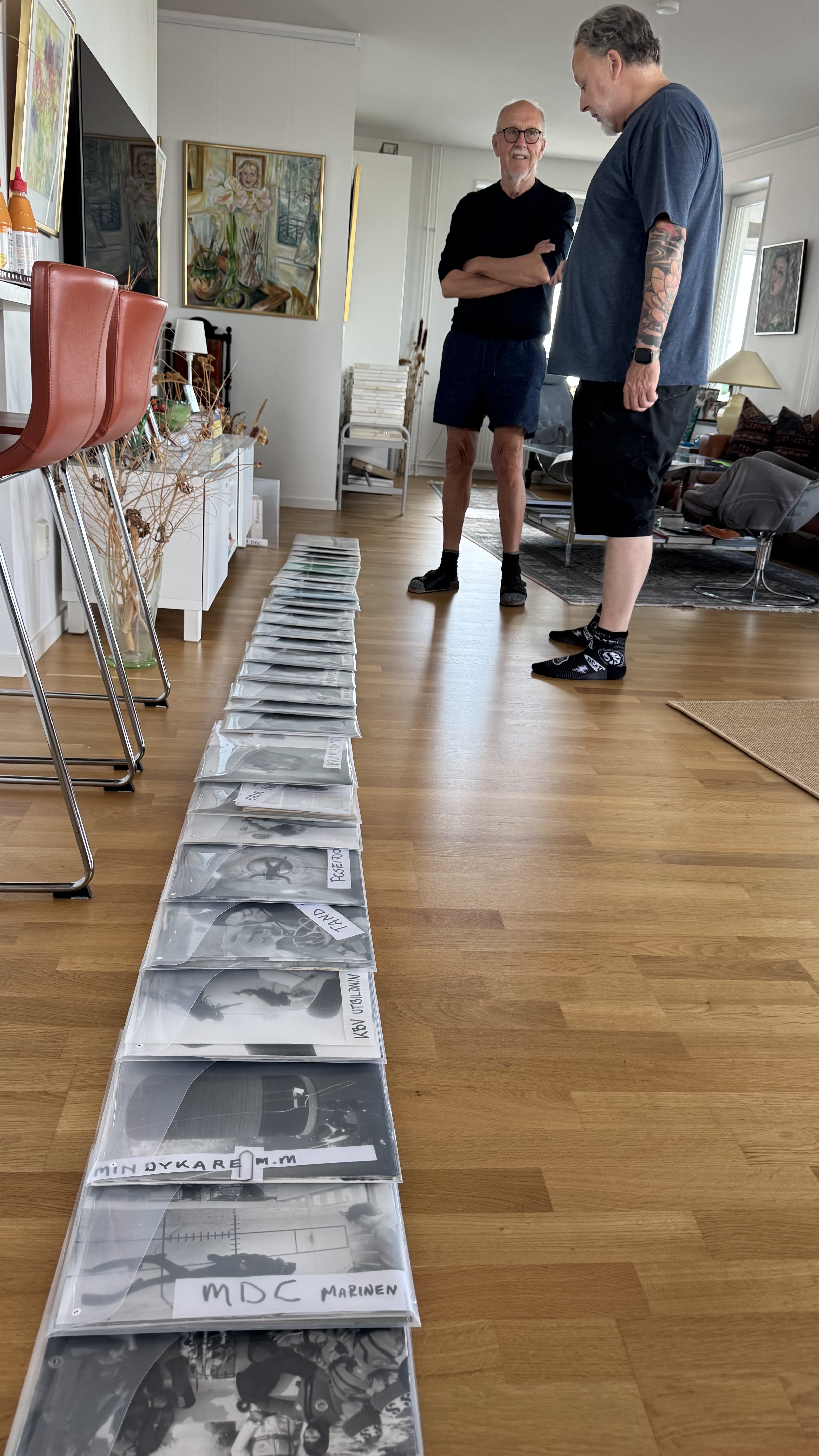 Archive albums laid out for review — a small selection of the thousands of catalogued images being handed over to Ocean Archive.