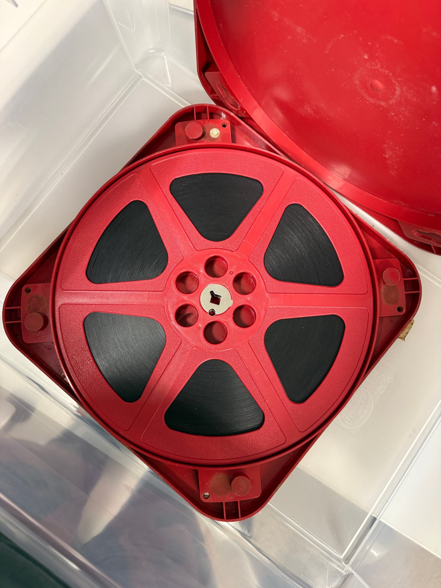 A 16mm film reel from the Börjeson collection in its original red case, awaiting cataloguing and digitisation.